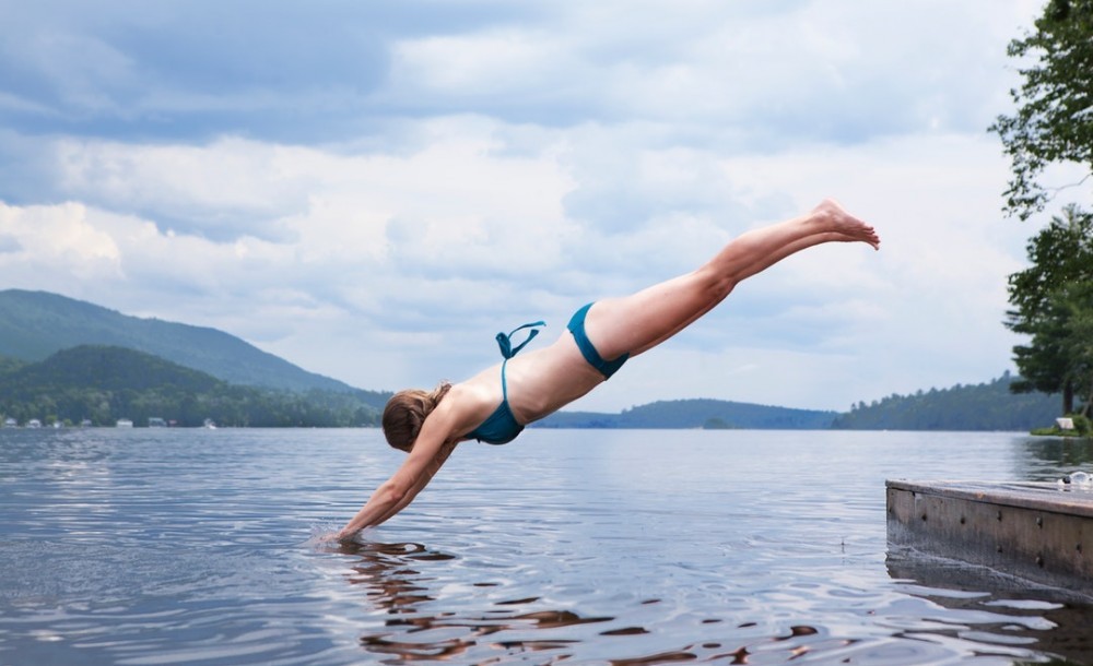 Women diving into water